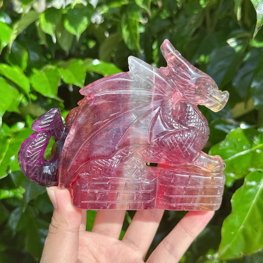 Stunning Rainbow Fluorite Dragon Carving with unique color contrasts and detailed features.