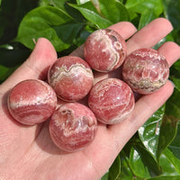 Rhodochrosite Sphere with natural pink and cream patterns