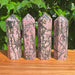 Rhodonite Tower showcasing unique pink and black patterns, perfect for crystal healing and decorative purposes.