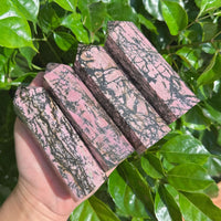 Rhodonite Tower with distinct pink and black veining, a beautiful piece for energy work and home decor.