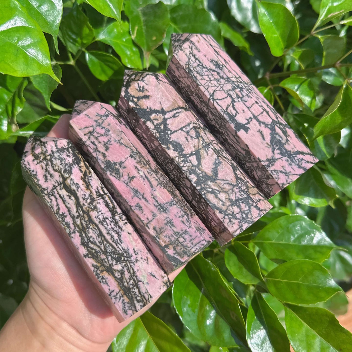 Rhodonite Tower with distinct pink and black veining, a beautiful piece for energy work and home decor.