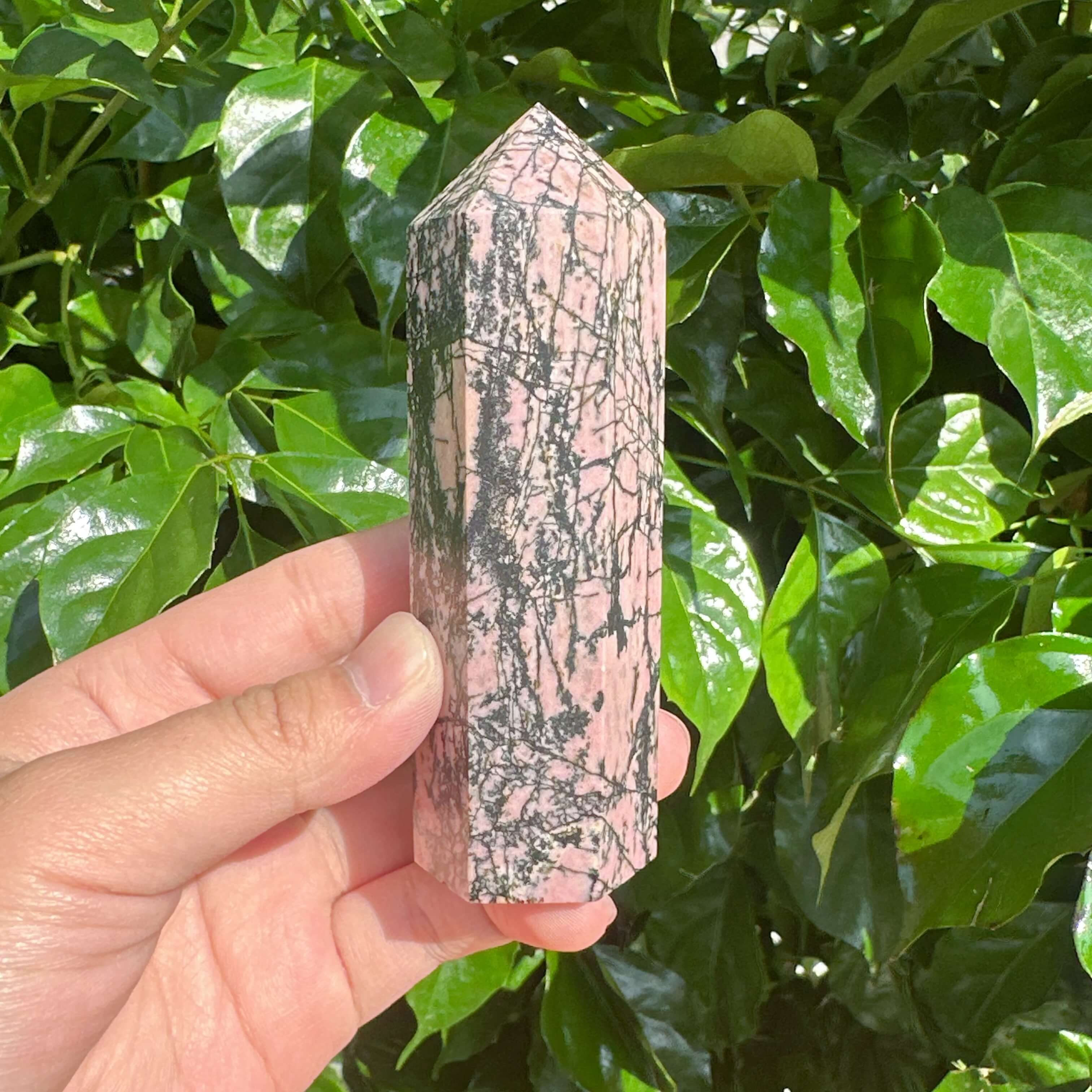 Rhodonite Tower with intricate black veins, offering both beauty and healing energy for your space.