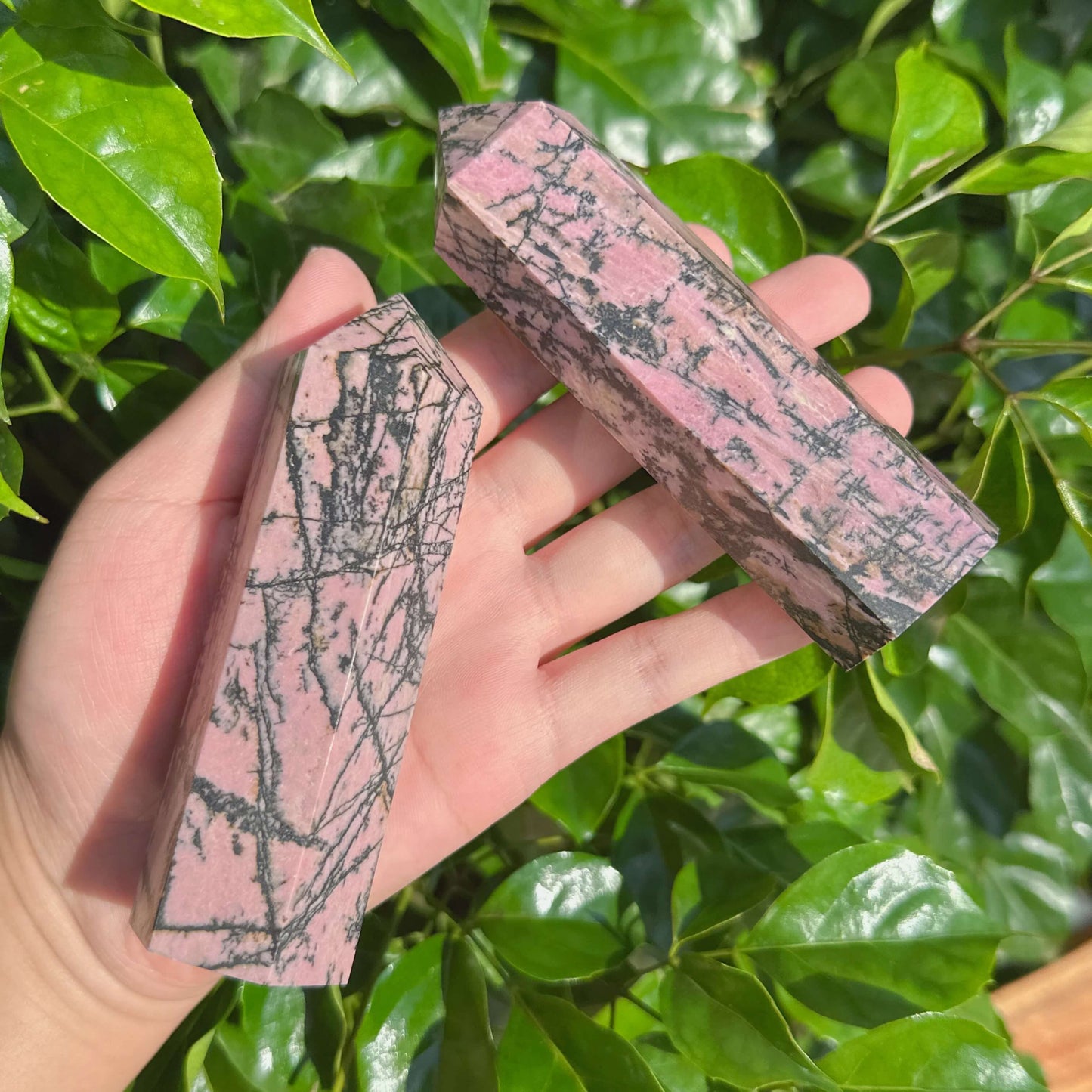 Detailed shot of a Rhodonite Tower with distinct color patterns, perfect for display and meditation.