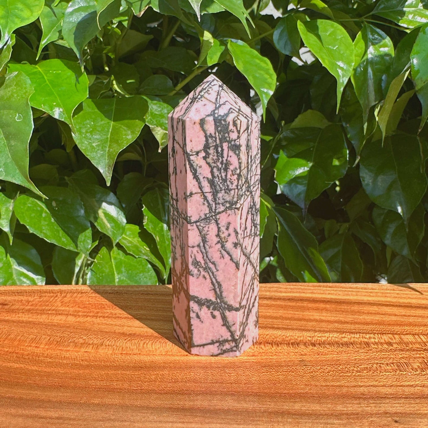 Rhodonite Towers displayed together, showcasing the stunning pink and black hues that make each piece unique.