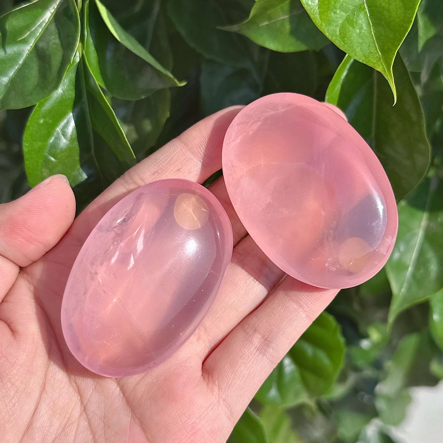 Angled view of Rose Quartz Palm, showcasing its refined shape and calming properties for emotional well-being.