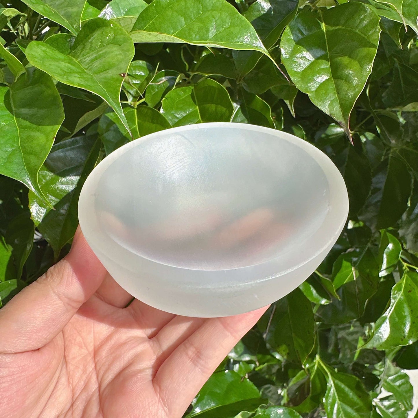Selenite Crystal Bowl with round shape, promoting positive energy and tranquility, ideal for holistic healing.