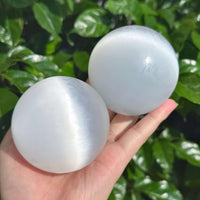 A pair of pristine selenite spheres, perfect for use in meditation and enhancing positive energy.
