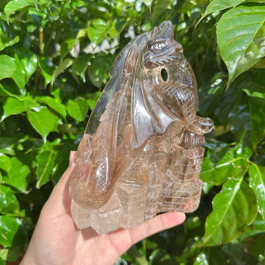 Close-up view of the Smoky Quartz Dragon Carving showcasing the fine details.