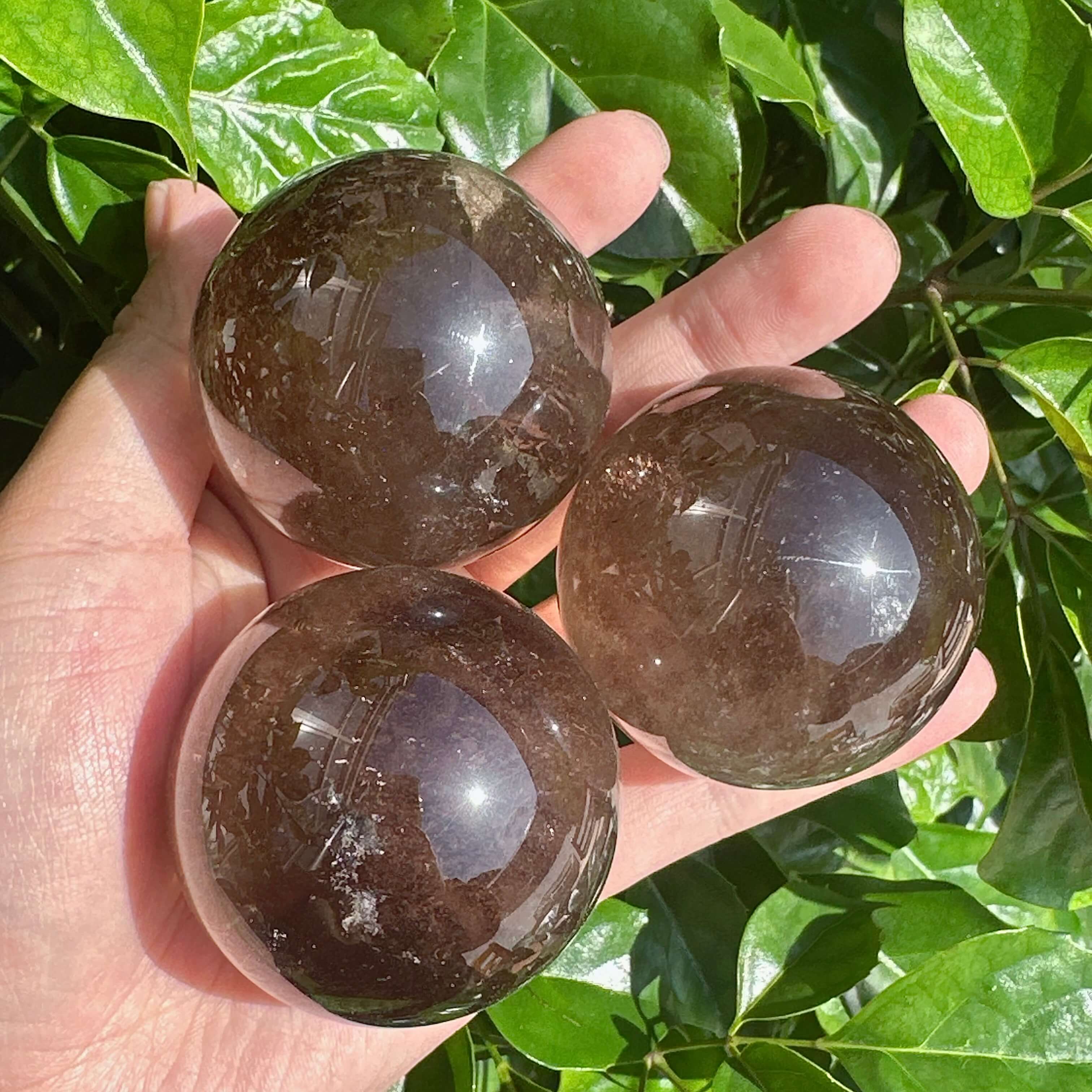Smoky Quartz Sphere showcasing its natural clarity and grounding energy, perfect for healing and meditation.