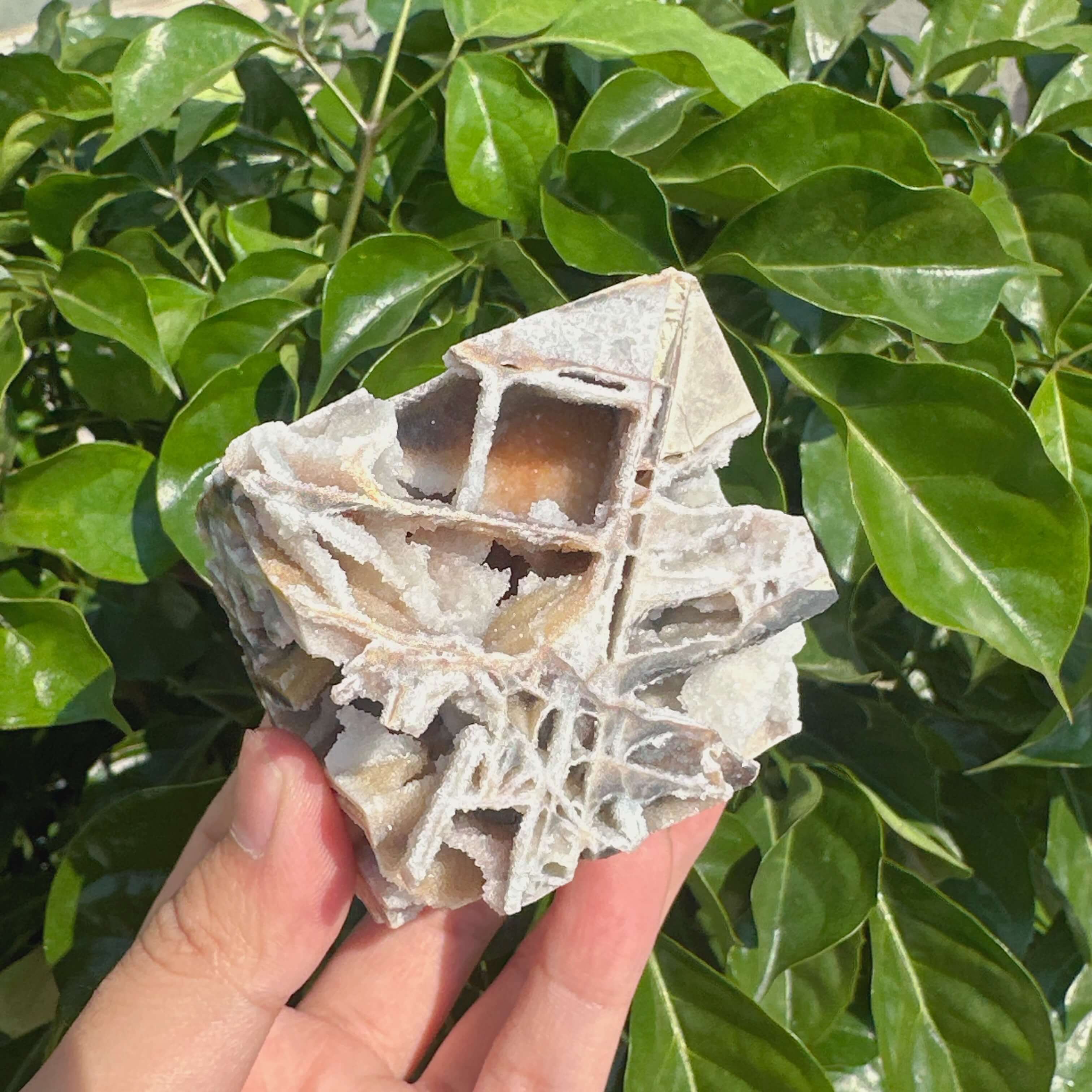 Side view of Sphalerite Cube, highlighting its intricate crystal formation and smooth surface.
