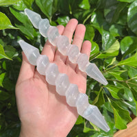 Close-up of Spiral Selenite Wand highlighting its distinct spiral pattern and clarity.
