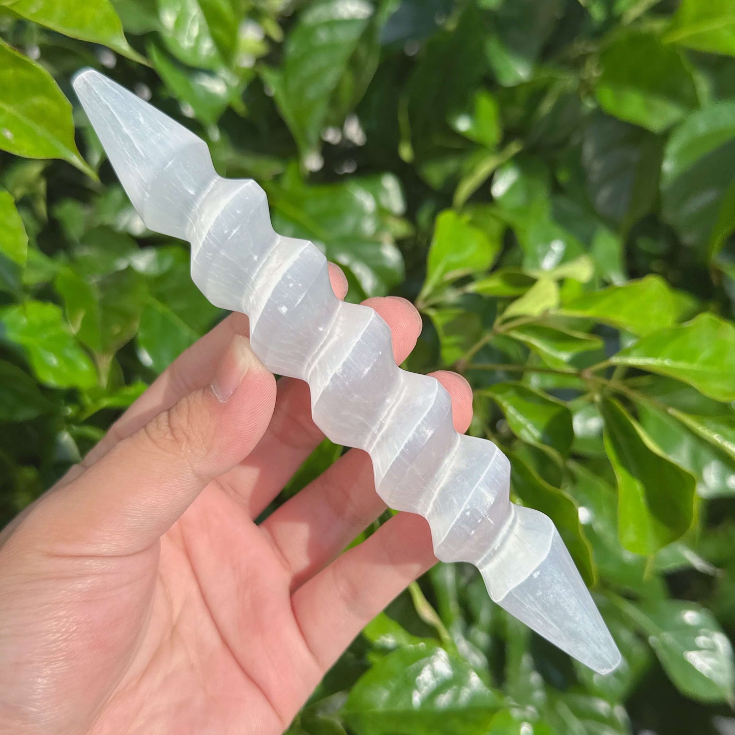 Elegant Spiral Selenite Wand featuring a crystalline structure ideal for energy clearing.