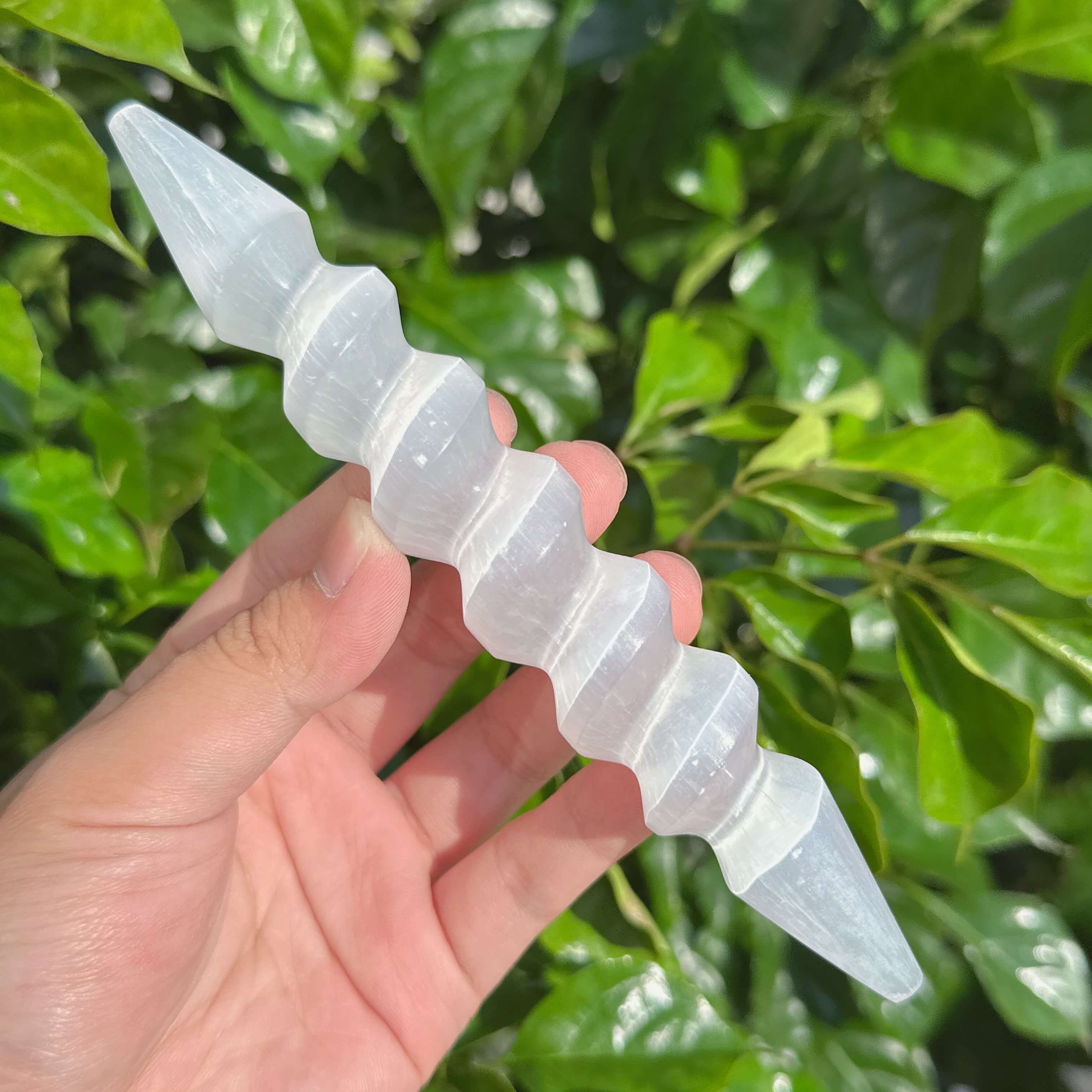 Elegant Spiral Selenite Wand featuring a crystalline structure ideal for energy clearing.