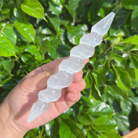 A pair of Spiral Selenite Wands with clear, smooth textures for spiritual alignment.