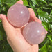 Close-up of the Star Rose Quartz Sphere, highlighting its translucent pink hues and the gentle star-shaped reflection at its center.