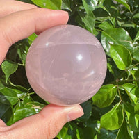 Star Rose Quartz Sphere showing the perfect round shape and the soft pink color, ideal for home decor and spiritual healing.