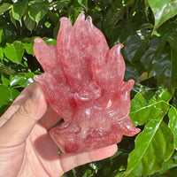 Close-up of the Strawberry Quartz Nine-Tailed Fox Carving, capturing the fine craftsmanship and pink hue.