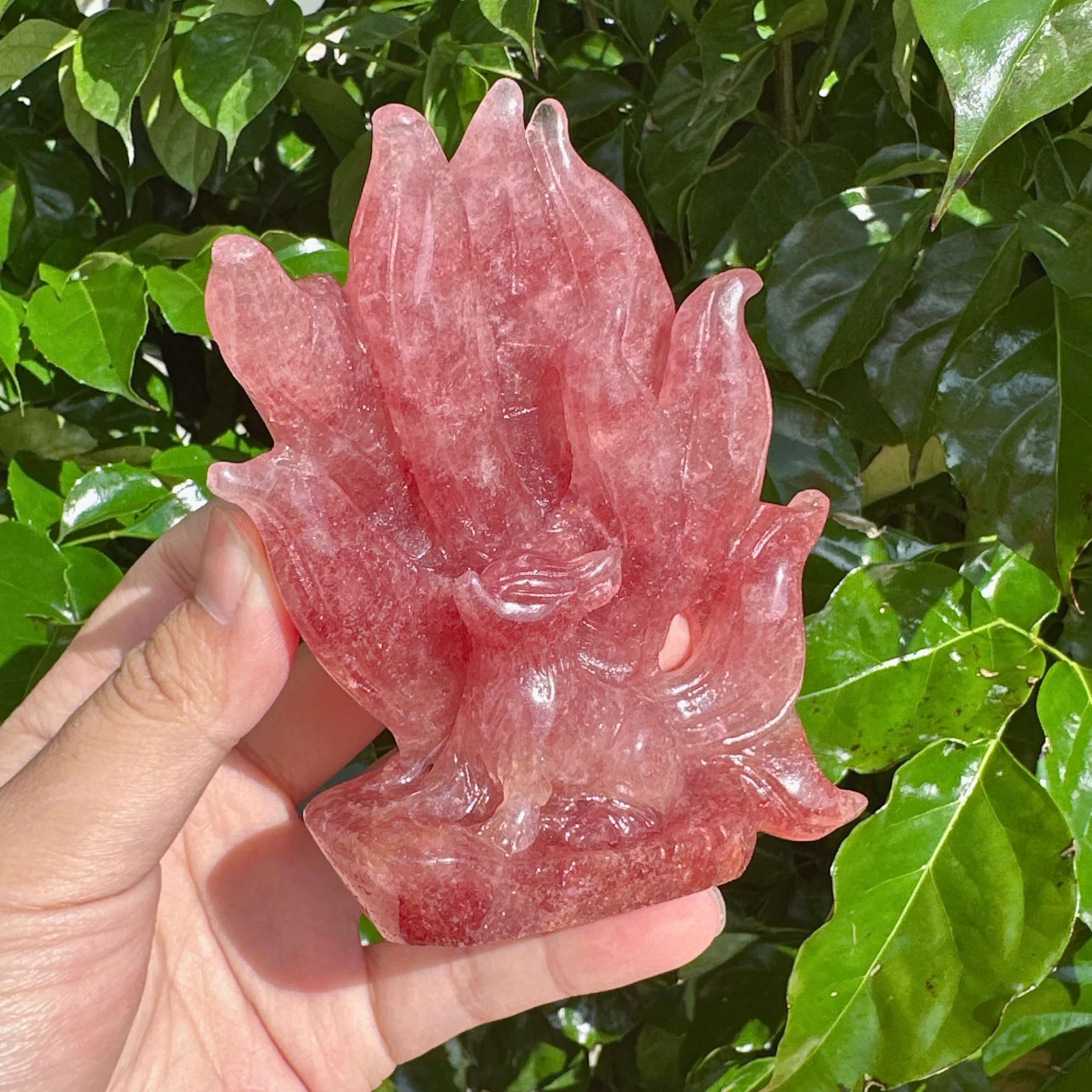 Close-up of the Strawberry Quartz Nine-Tailed Fox Carving, capturing the fine craftsmanship and pink hue.
