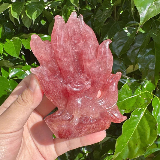 Close-up of the Strawberry Quartz Nine-Tailed Fox Carving, capturing the fine craftsmanship and pink hue.