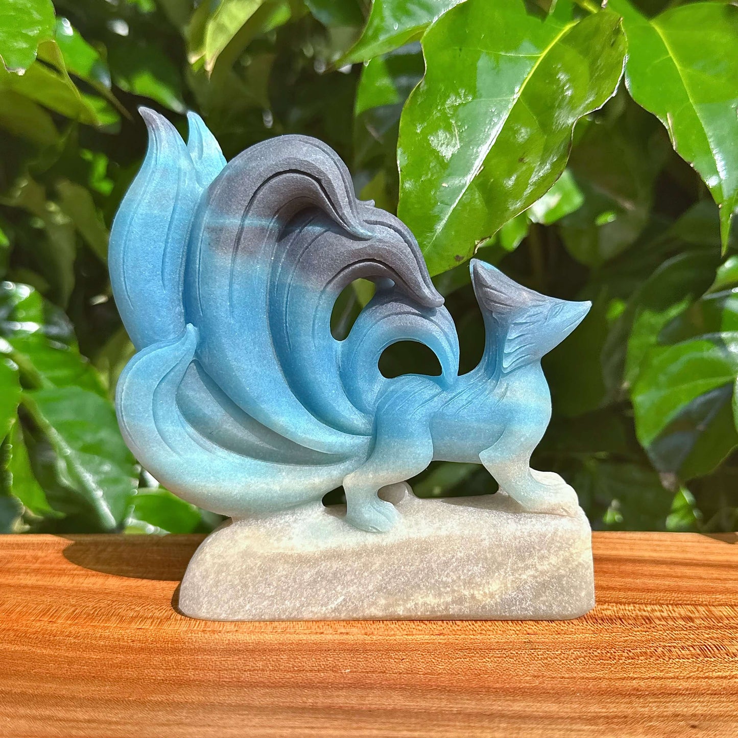 Trolleite Nine-Tailed Fox Carving showcasing vibrant blue hues and intricate details