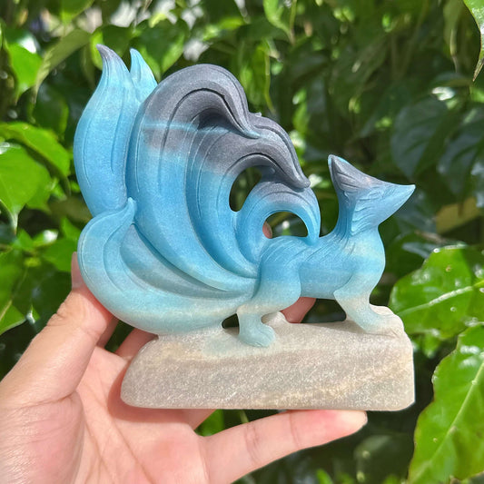 Side view of the Trolleite Nine-Tailed Fox Carving, capturing the fine craftsmanship of its features