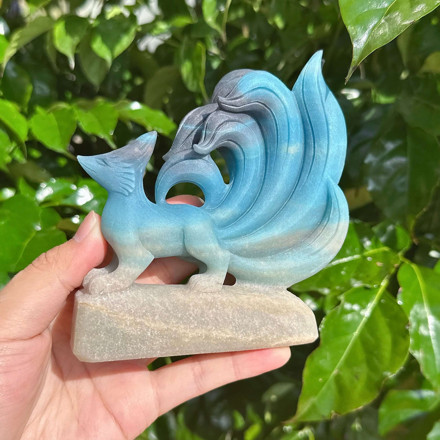 Close-up of Trolleite Nine-Tailed Fox Carving showing fine crystal details and smooth texture