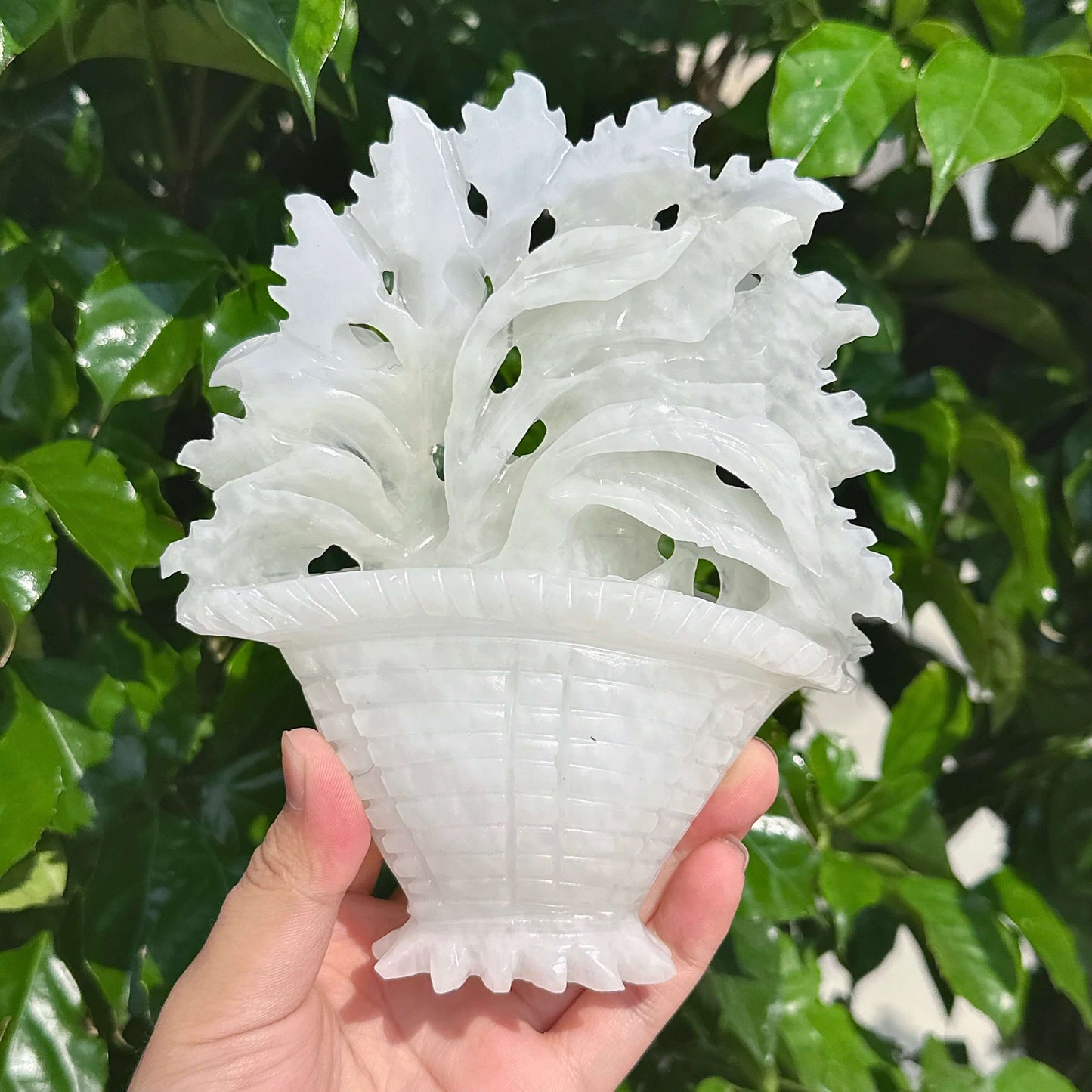 Close-up of White Jade Flower Basket Carving showing delicate leaf patterns