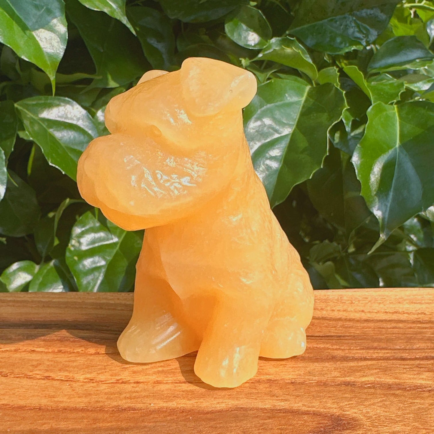Side view of Yellow Calcite Schnauzer Dog Carving, showcasing its detailed craftsmanship.