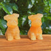 Unique Yellow Calcite Schnauzer Dog Carving, featuring natural orange hues and fine detailing.