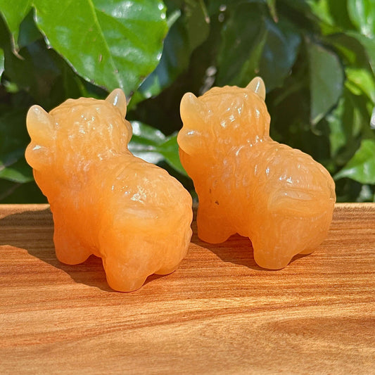 Yellow Calcite Highland Cattle Carving – Another group shot with detailed views of the crystal sculptures from different angles.