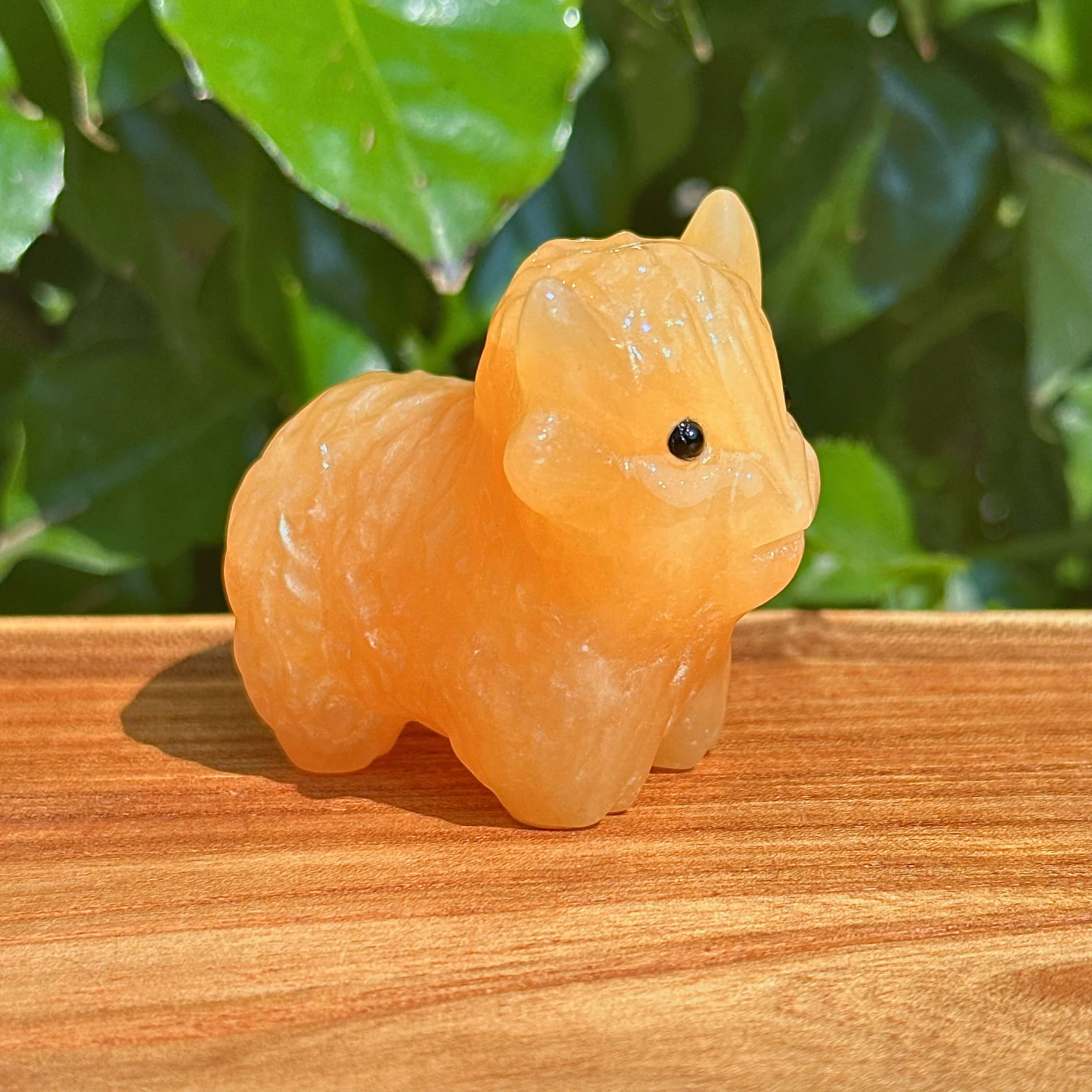 Yellow Calcite Highland Cattle Carving – Handheld view, demonstrating the size and unique design of this collectible crystal sculpture.