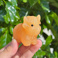 Yellow Calcite Highland Cattle Carving – Side profile showing the full form of the Highland Cattle sculpture.